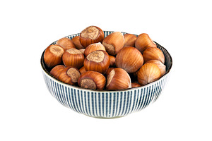 Bowl of hazelnuts isolated, a Food & Drink Photo by BOOCYS