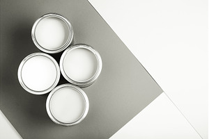 White paint cans on monochrome, a Background Photo by Anna Efetova