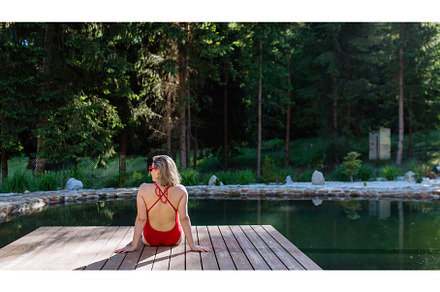 Rear view of young woman in swimsuit, a Nature Photo by HalfPoint