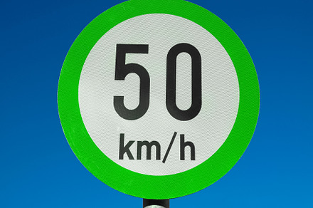 Green advisory speed limit sign