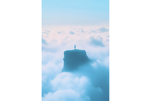 Solitary figure on mountain peak, a Nature Photo by Lermont51