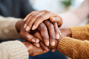 Unity and support through diverse hands, a Person Photo by AlyaAnd