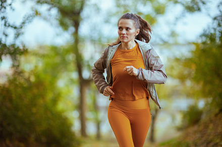 fit woman in fitness clothes in park running, a Sports & Recreation Photo by Alliance Images