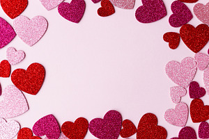Stylish valentine hearts flat lay. Pink and red glitter hearts o, a Holiday Photo by Sonjachni