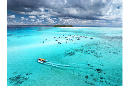 Aerial view of boats in clear azure, a Nature Photo by den-belitsky