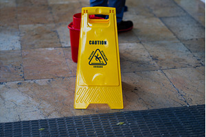 Yellow plastic wet floor caution, an Industrial Photo by volodymyrshtun13795