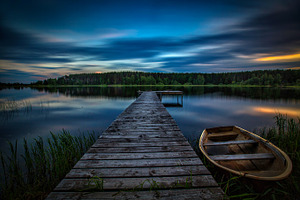 Sunset on the lake featuring sunset, nature, and boat