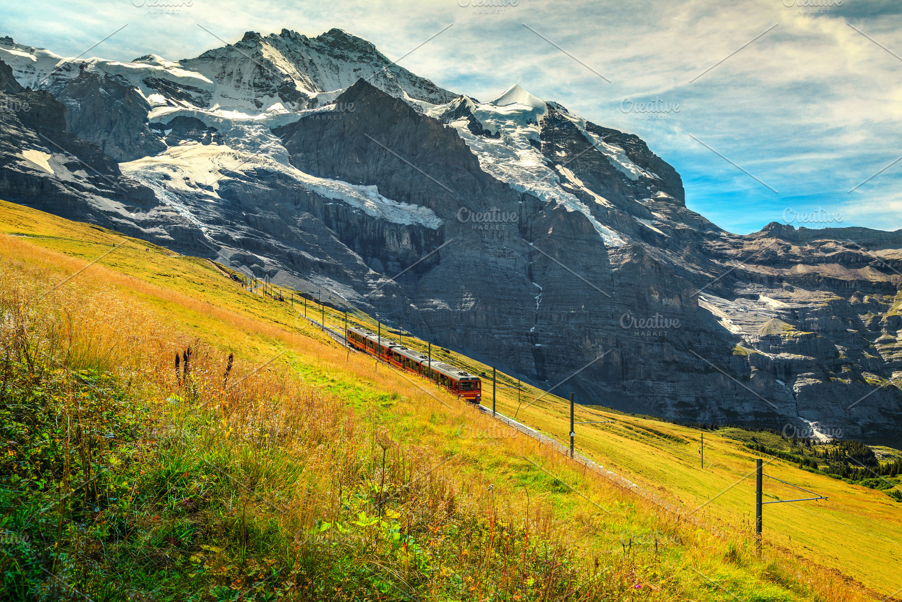 Electric tourist train in mountains, a Transportation Photo by Alpine Dreams
