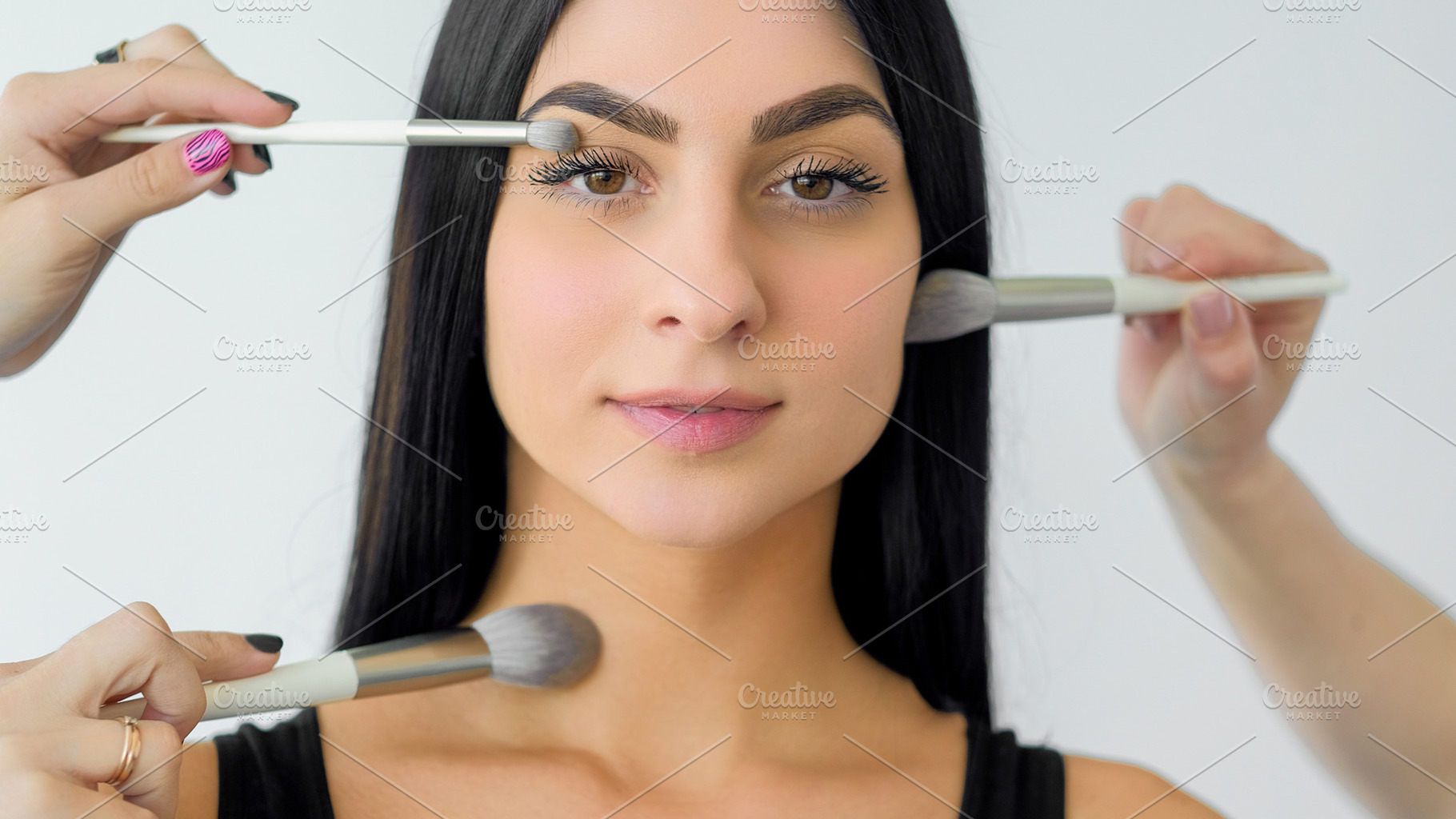 Cosmetic model applying powder face skin makeup, a Person Photo by Photo Drive Studio