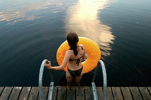 Girl with water wheel ready to swim, a Person Photo by BOOCYS