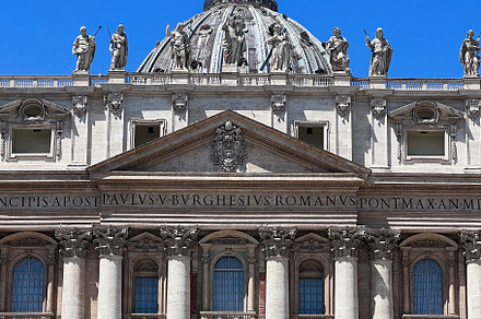 St. Peter's Basilica facade under a clear blue sky, Vatican City., a Photo by AS photostudio