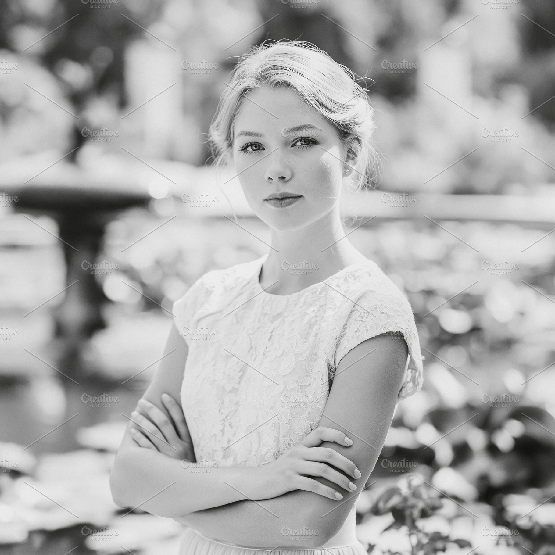 Elegant blonde woman posing outdoors with arms crossed, portrayi, a Person Photo by Studio ANNA