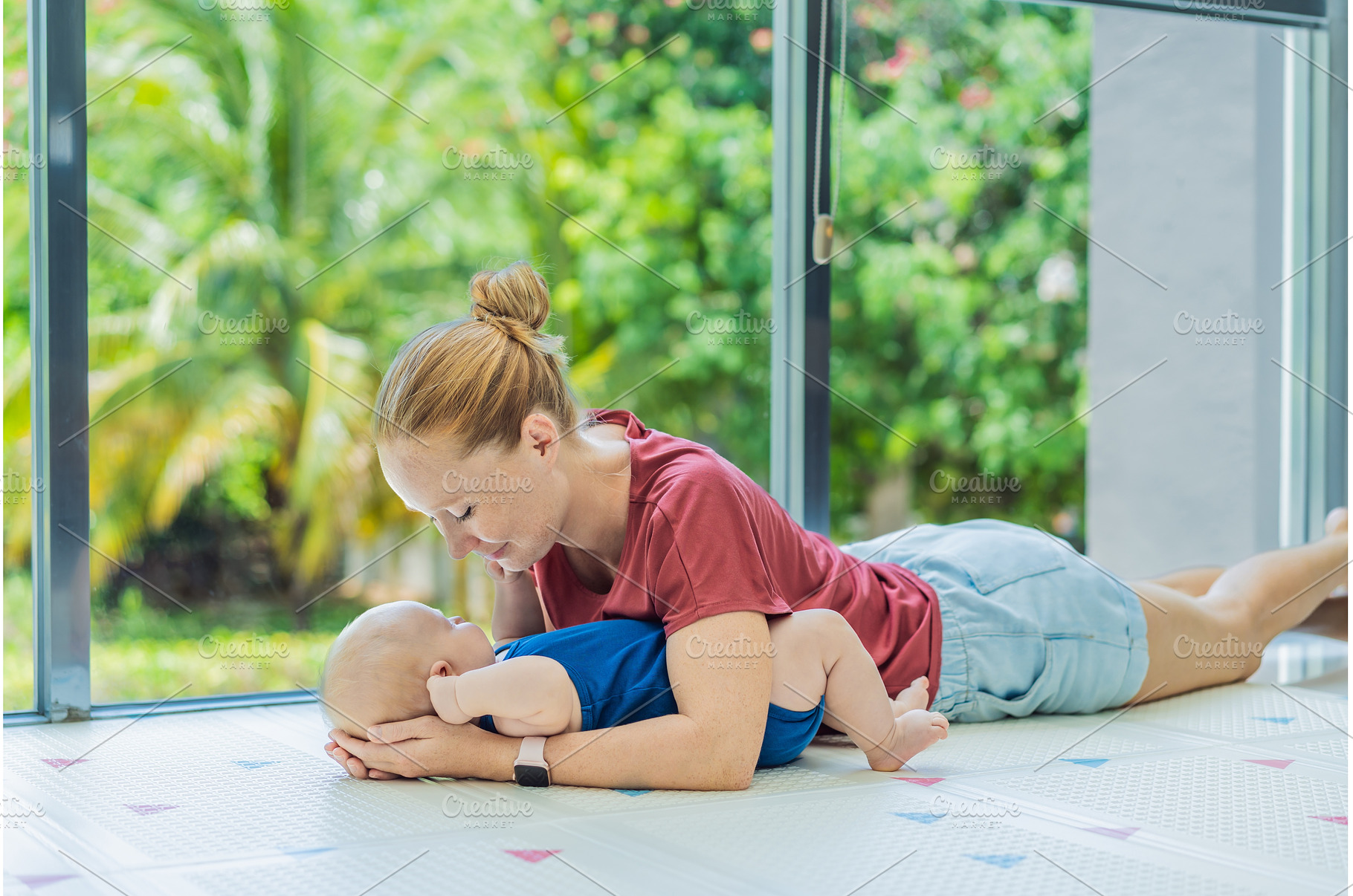 Mother and baby lying on a soft play, an Architecture Photo by Elizaveta Galitskaya