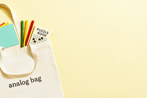 Analog bag with notebooks, puzzle bo, a Photo by Dvoevnore photos
