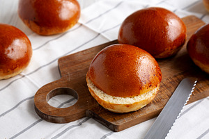 Homemade Brioche Buns Ready to Eat, side view., a Food & Drink Photo by LiudmylaChuhunova