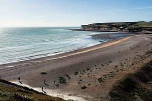 Tranquil coastal scene at Seven Sisters Cliffs in East Sussex with people on th, a Nature Photo by AS photostudio