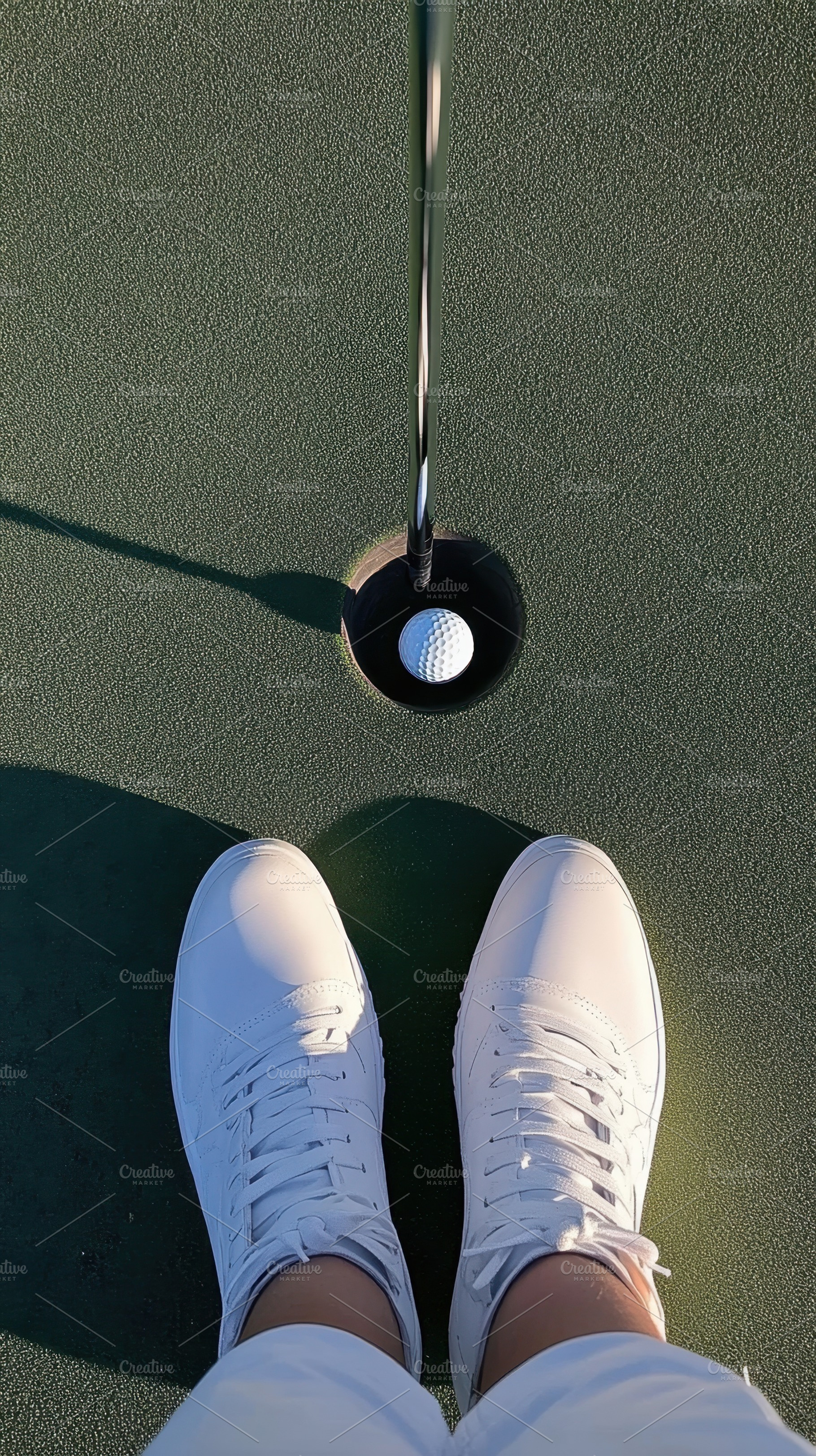 Golf ball by the hole, a Photo by Beautiful things