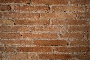 Rustic brick wall displaying a, a Background Photo by volodymyrshtun13795