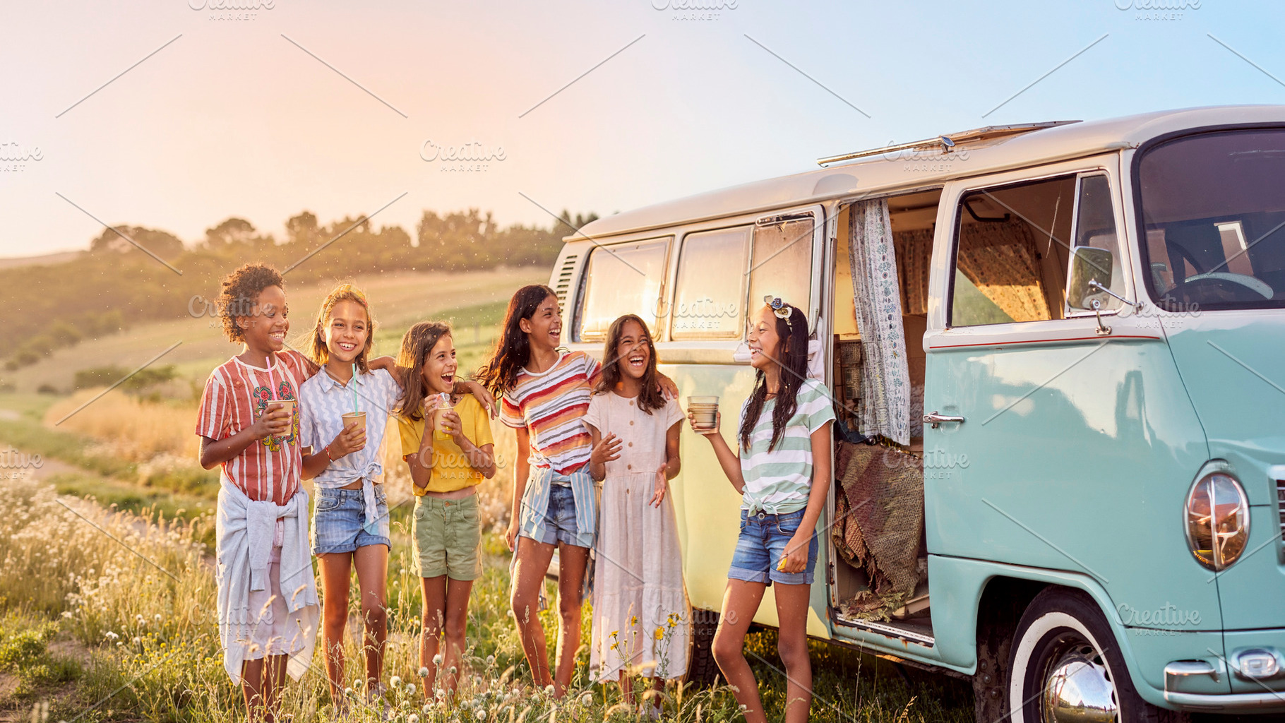 Children laughing beside vintage camper van, a Person Photo by DanFLCreativo