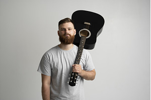 Bearded young man in grey t-shirt, a Person Photo by volodymyrshtun13795