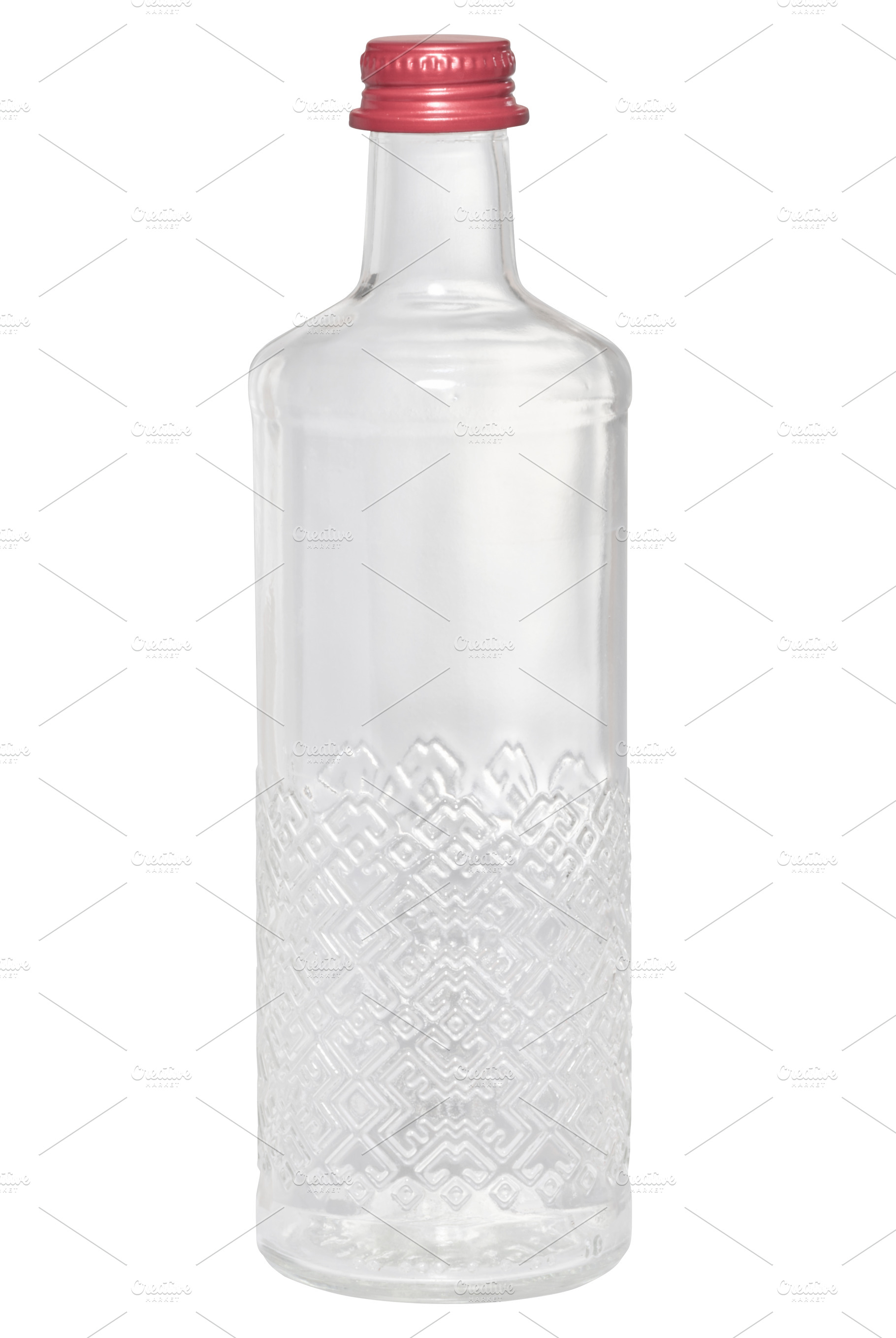 Empty transparent glass bottle with a relief pattern and a red s, a Food & Drink Photo by ndanko