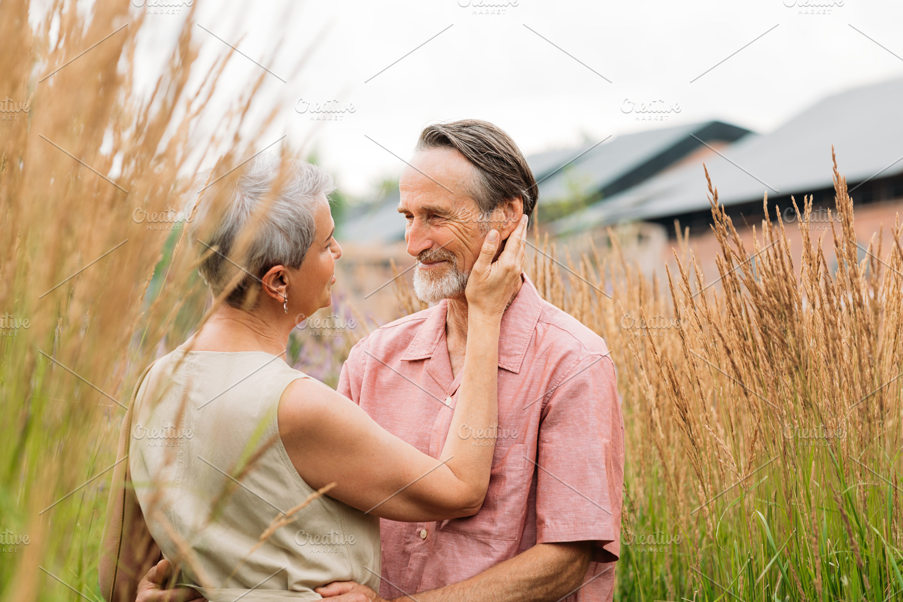 Aged romantic couple on a field, a Person Photo by Artem Varnitsin