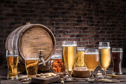 Glasses of beer and ale barrel containing alcohol, ale, and ale barrel, a Food & Drink Photo by Volff