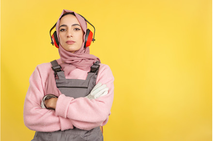 Serious muslim female carpenter in, a Person Photo by Iván Moreno STOCK PHOTO