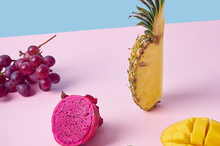 Tropical fruits variety on a colorful background. Side view with