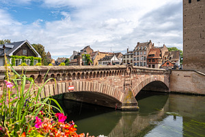 Stone bridge and traditional houses in Strasbourg, France, an Architecture Photo by GoodGoods