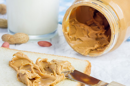 Creamy peanut butter with nuts, a Food & Drink Photo by iuliia_n