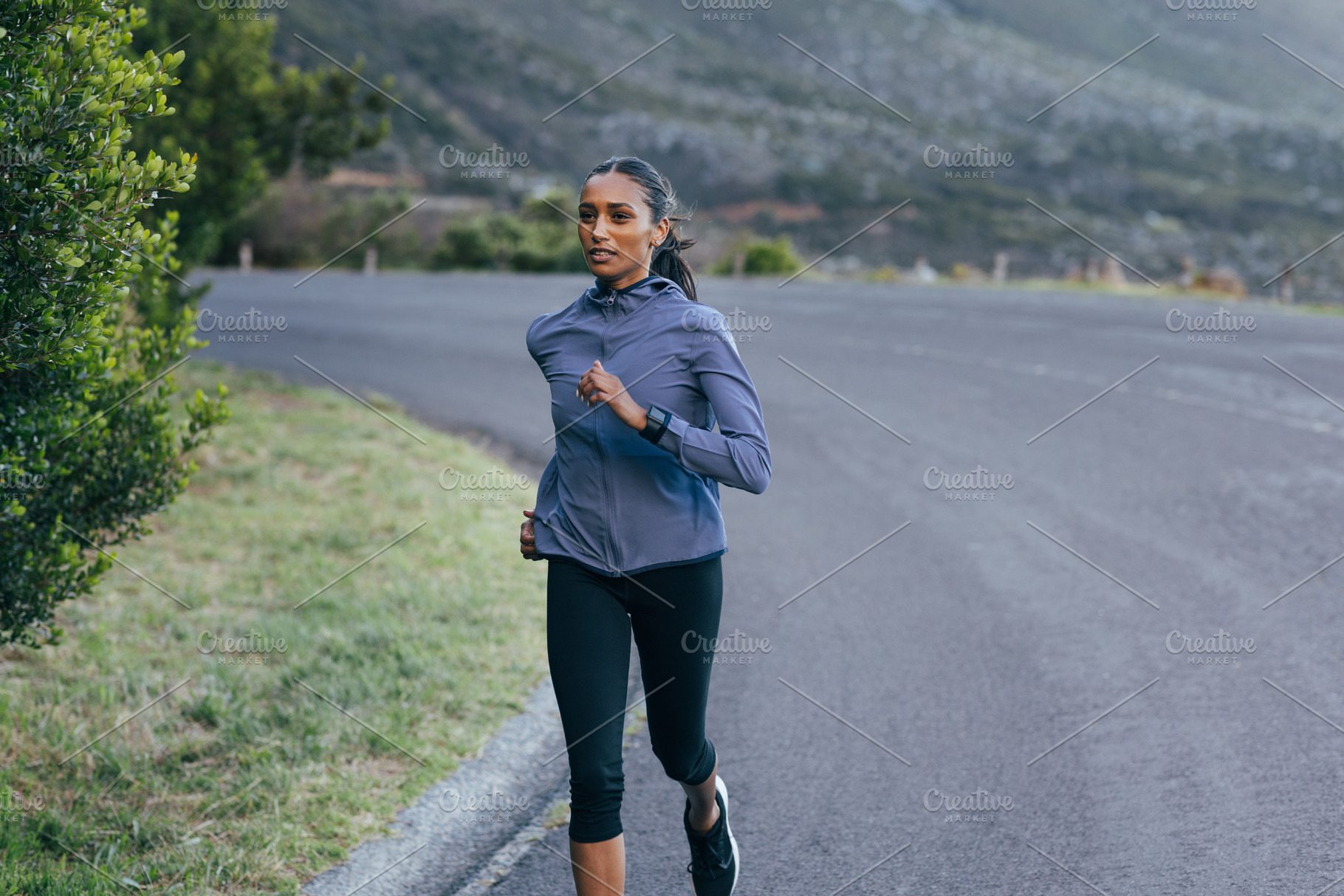 Slim woman runner on road, a Sports & Recreation Photo by Artem Varnitsin