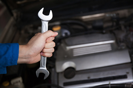 Man in blue technician uniform going to repair for car maintenance containing, an Industrial Photo by Twinster Photo