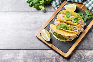Mexican chicken tacos with guacamole and cilantro