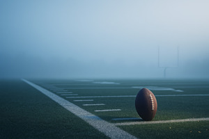 American football on a misty field d, a Photo by Dvoevnore photos
