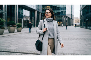 Woman Walking on City Street, a Person Photo by CREATIVEDEF