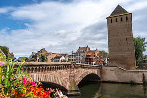Stone bridge and traditional houses in Strasbourg, France, an Architecture Photo by GoodGoods