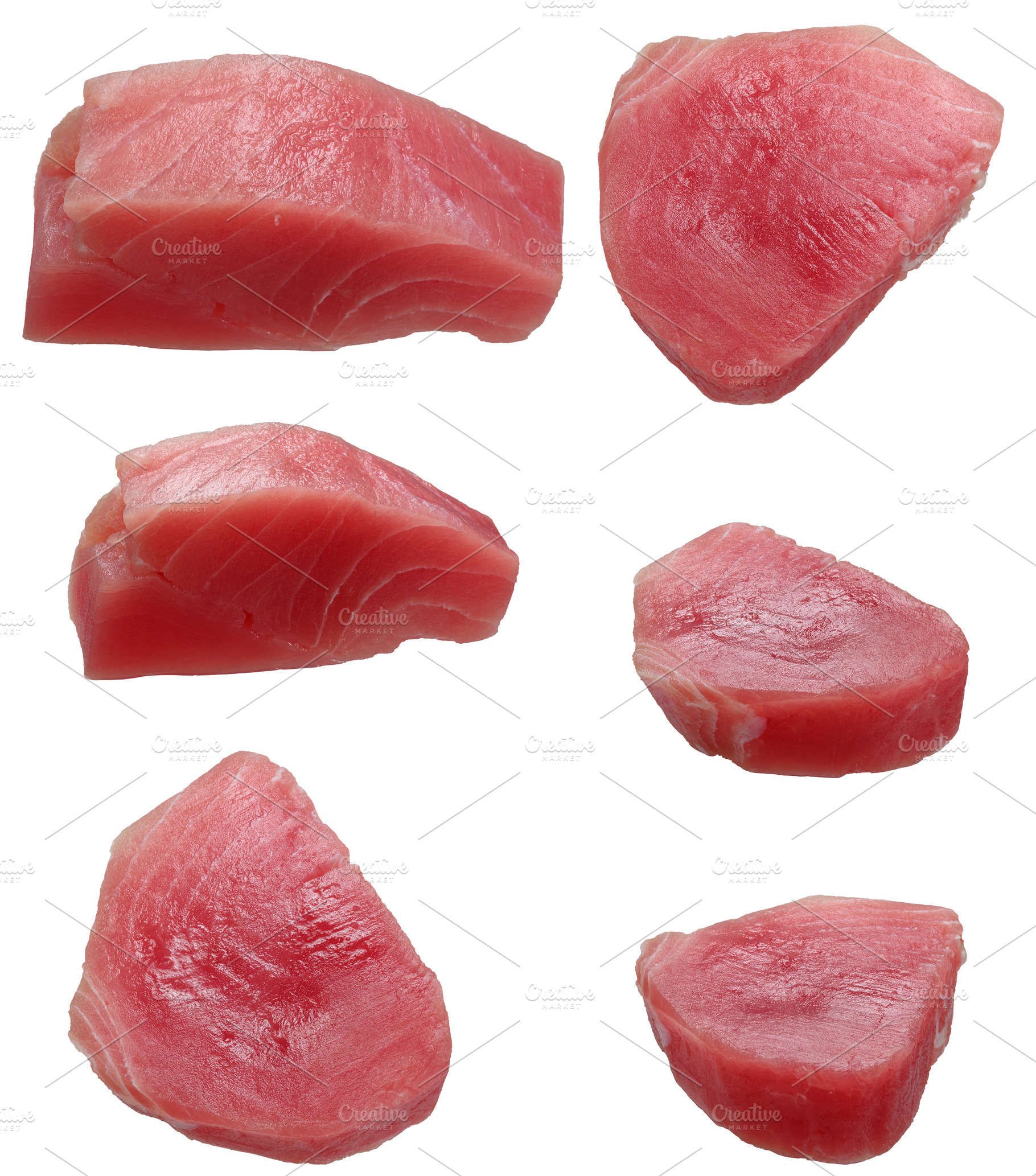 Various raw pieces of tuna on isolated background, a Food & Drink Photo by ndanko