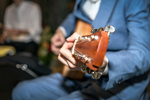 Acoustic guitar playing, an Arts & Entertainment Photo by KYNA STUDIO