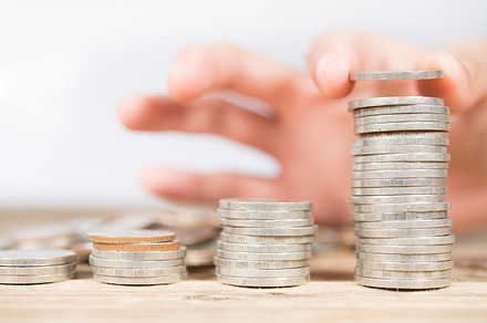 hand stacking money coin