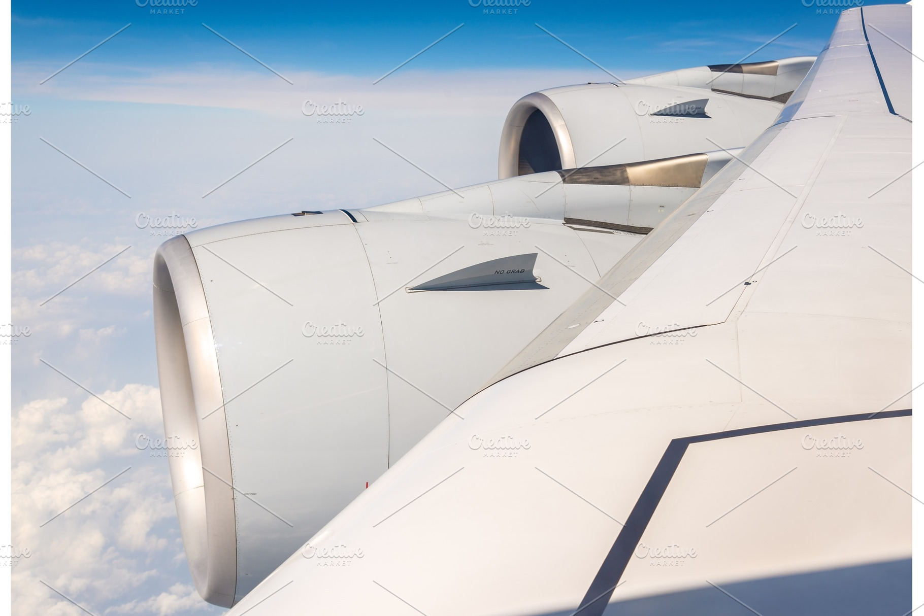 Wing with engines of airbus a380 flying over clouds containing wing, travel, a Transportation Photo by Leonid Andronov