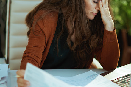 business owner woman in green office working with documents, a Person Photo by Alliance Images