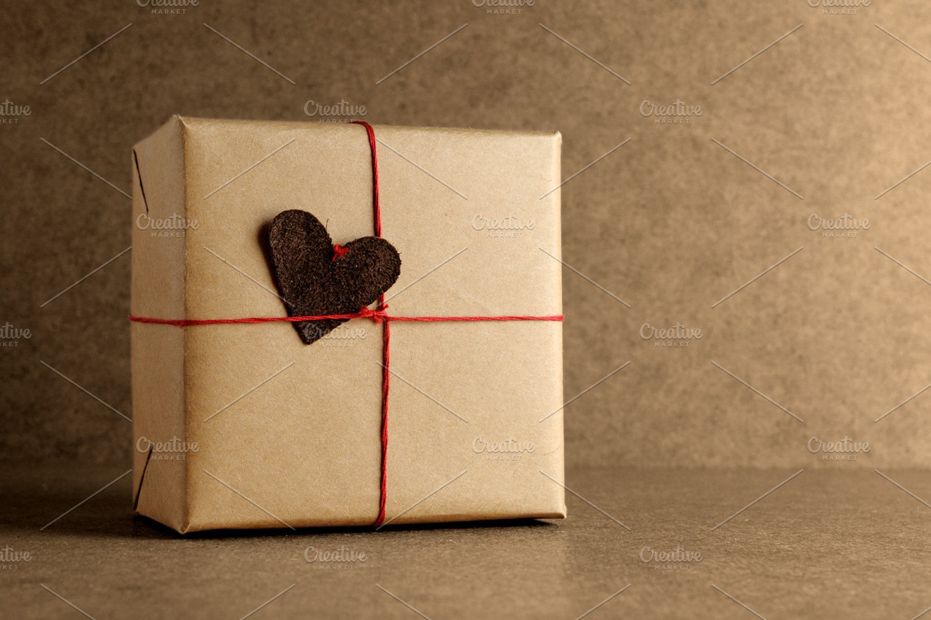 Wrapped gift box containing gift, box, and brown