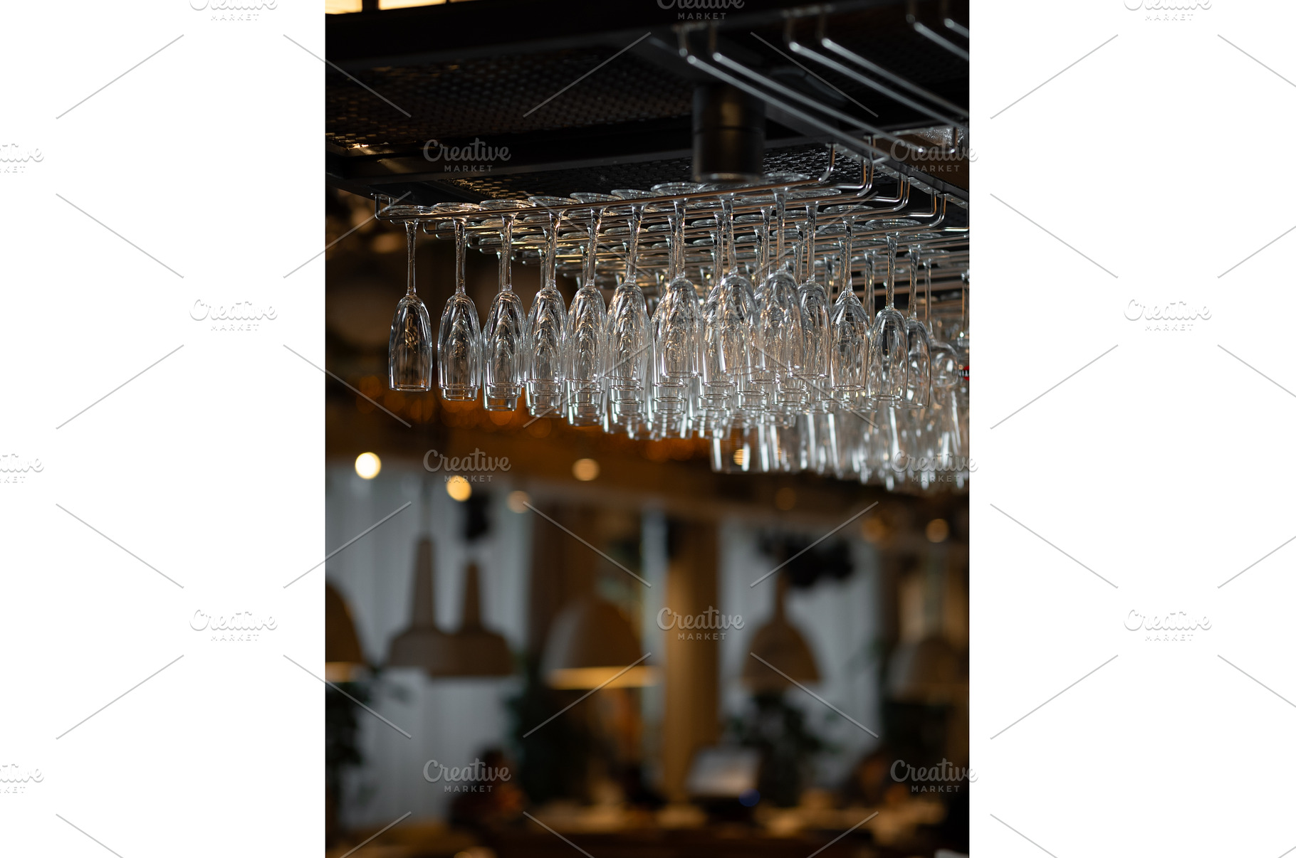 Row of clean empty glasses in bar, a Food & Drink Photo by Fascinadora