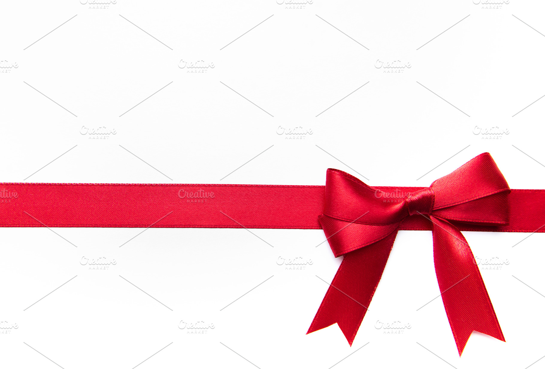 Red satin ribbon and bow for celebration designs, a Holiday Photo by Olena Rudo