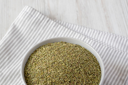 Organic Dried Rosemary in a Bowl, side view. Copy space., a Food & Drink Photo by LiudmylaChuhunova