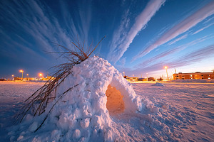 Snow structure under a starry sky with colorful clouds at dusk in a winter land, a Photo by AlyaAnd
