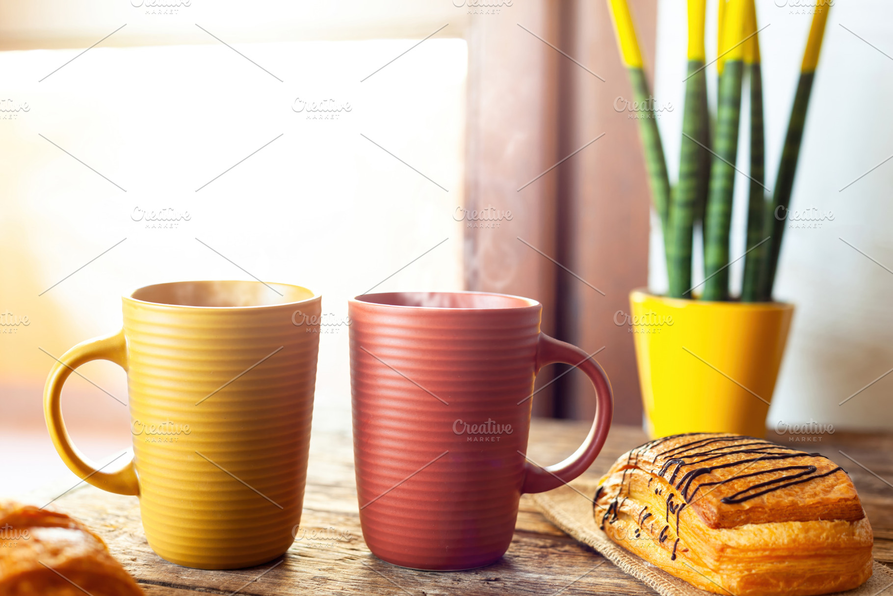 Steaming mugs and pastries enjoying morning sunlight near window, a Food & Drink Photo by Antonio Gravante Market