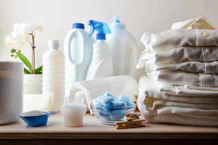 Laundry products and folded clothes on wooden bench isolated bac, a Health & Medical Photo by Davizro's Market