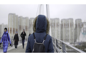 Woman walking on bridge as people, an Architecture Photo by Media Whale Stock